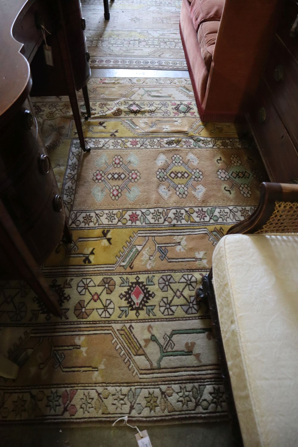 A near pair of Caucasian design fawn ground carpets, larger 350 x 210cm